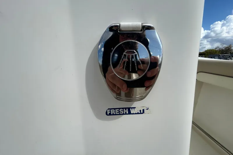 Slide: The Image of 2018 NauticStar 28 XS boat fresh water access with chrome cover. - 59