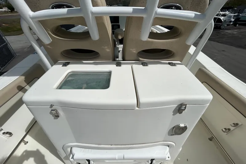Slide: The Image of 2018 NauticStar 28 XS boat with storage compartments and seating area. - 60