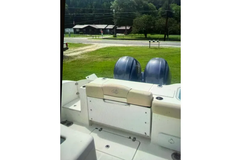 Slide: The Image of 2018 NauticStar 28 XS boat on trailer, viewed from front under blue sky. - 7