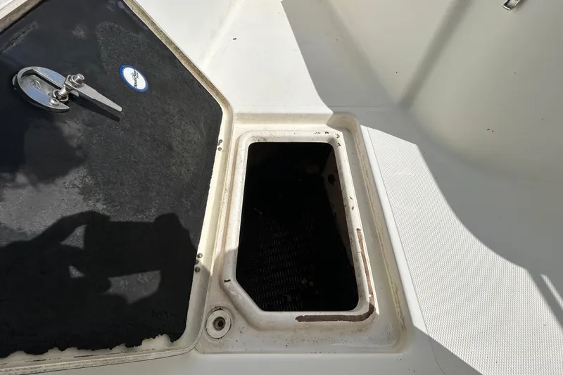 Slide: The Image of Open storage compartment on 2018 NauticStar 28 XS boat deck. - 84