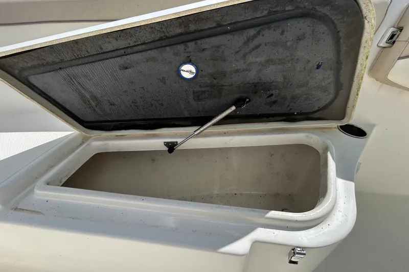 Slide: The Image of Open storage compartment on a 2018 NauticStar 28 XS boat. - 87