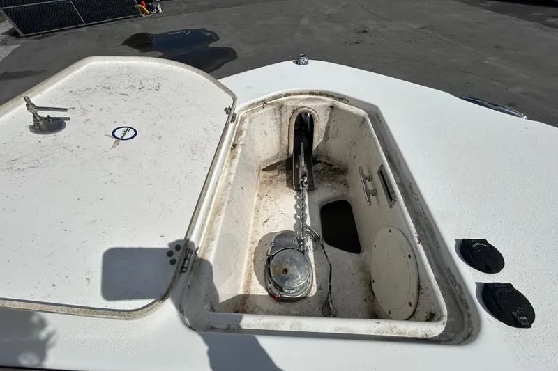 Slide: The Image of 2018 NauticStar 28 XS anchor compartment with chain and winch. - 90