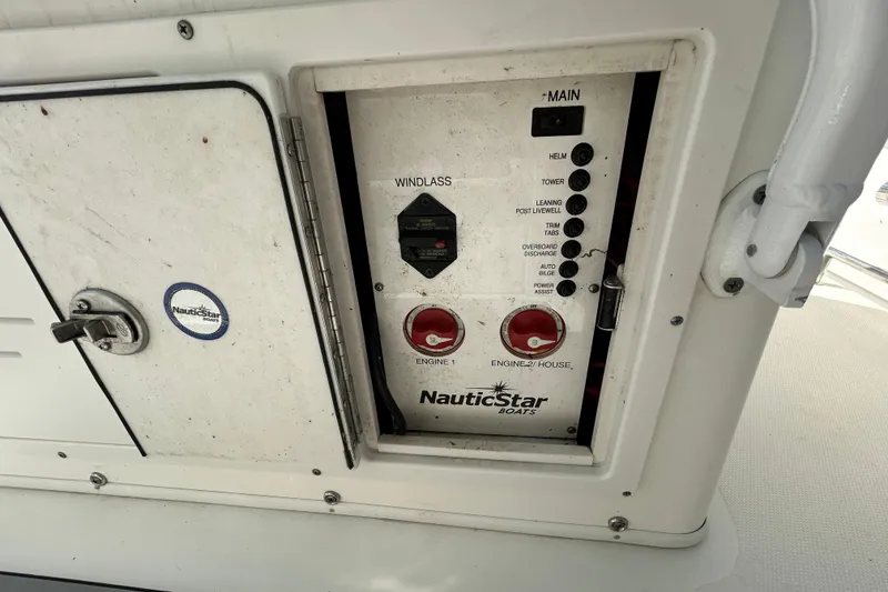 Slide: The Image of Control panel of a 2018 NauticStar 28 XS boat with various switches and labels. - 96