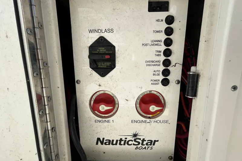 Slide: The Image of Control panel of a 2018 NauticStar 28 XS boat with labeled switches and circuit breaker. - 97