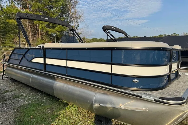 The Image of 2026 Bentley Pontoons Legacy 243 Swingback, blue and white, parked outdoors. - 1