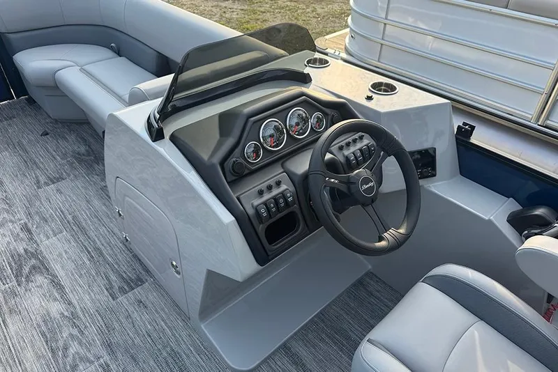 Slide: The Image of 2026 Bentley Pontoons Legacy 243 Swingback interior with modern dashboard and seating. - 17