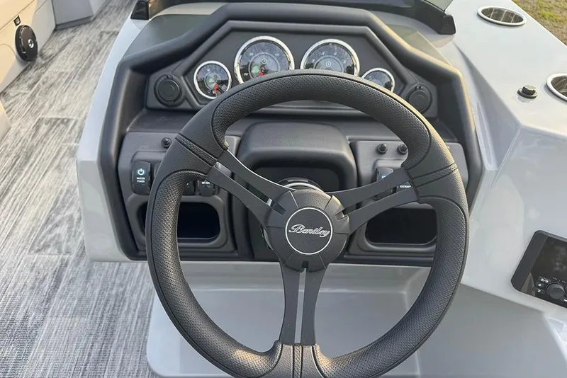 Slide: The Image of Steering wheel and dashboard of 2026 Bentley Pontoons Legacy 243 Swingback boat. - 18