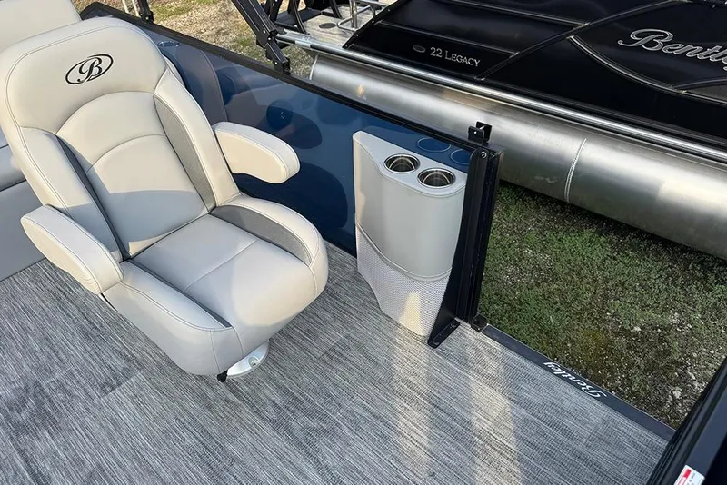 Slide: The Image of 2026 Bentley Pontoons Legacy 243 Swingback interior with luxury seating and cup holders. - 20
