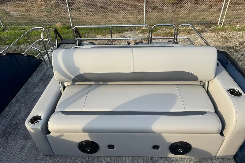 Slide: The Image of 2026 Bentley Pontoons Legacy 243 Swingback with luxurious seating and cup holders. - 21