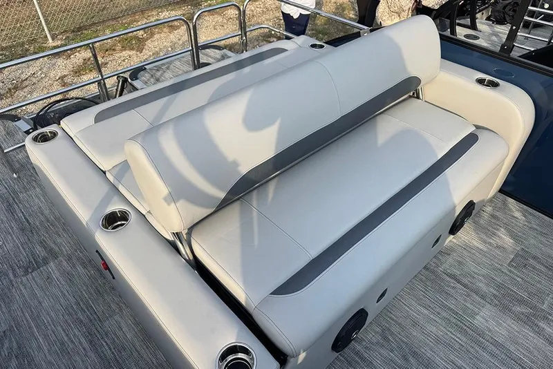 Slide: The Image of 2026 Bentley Pontoons Legacy 243 Swingback with luxurious seating and cup holders. - 23