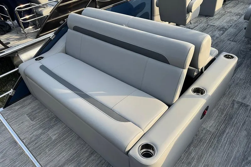 Slide: The Image of 2026 Bentley Pontoons Legacy 243 Swingback with luxurious seating and cup holders. - 26