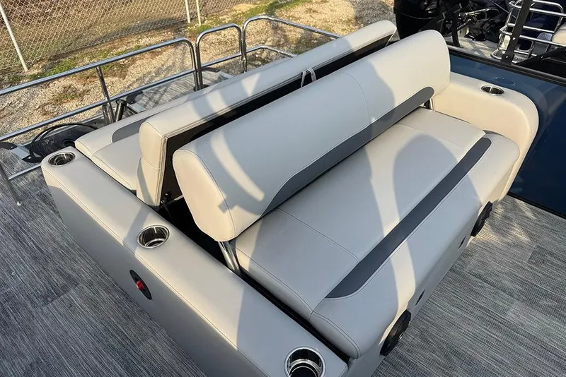 Slide: The Image of 2026 Bentley Pontoons Legacy 243 Swingback with luxurious seating and cup holders. - 27