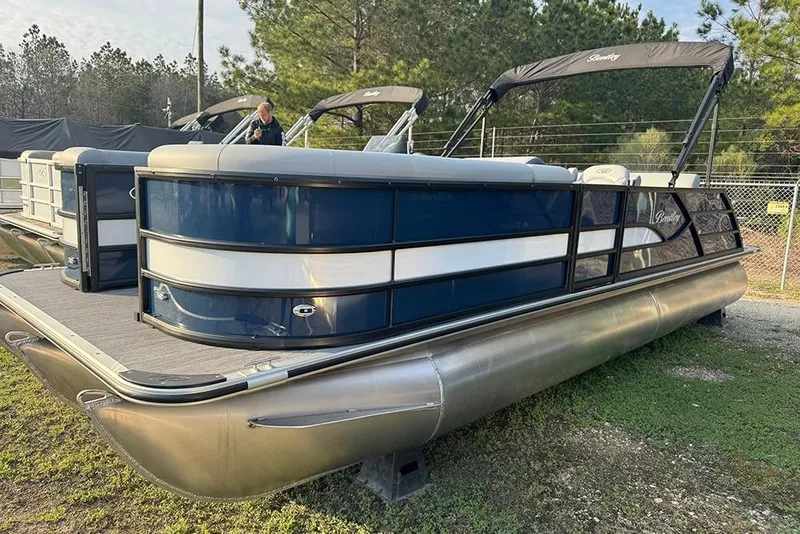 Slide: The Image of 2026 Bentley Pontoons Legacy 243 Swingback, sleek design, parked outdoors, showcasing luxury and style. - 5