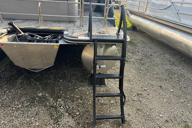 Slide: The Image of 2026 Bentley Pontoons Legacy 243 Swingback with rear ladder and engine compartment. - 8