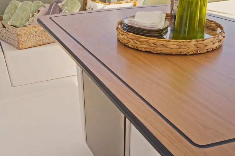 Slide: The Image of Modern Bali 5.2 yacht interior with wooden table, wicker basket, and elegant decor, 2026 model. - 10