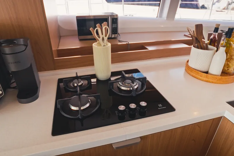 Slide: The Image of Modern kitchen in 2026 Bali 5.2 yacht with stove, coffee maker, and utensils. - 17
