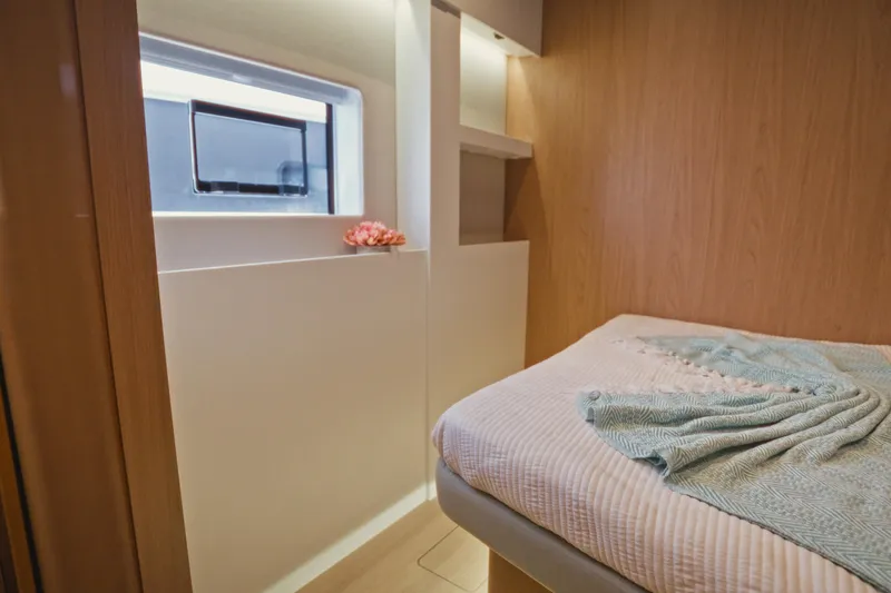 Slide: The Image of Modern interior of 2026 Bali 5.2 yacht cabin with cozy bed and window. - 22