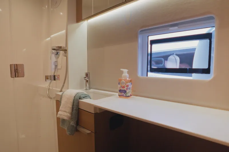 Slide: The Image of Modern bathroom interior of 2026 Bali 5.2 yacht with window and toiletries. - 27