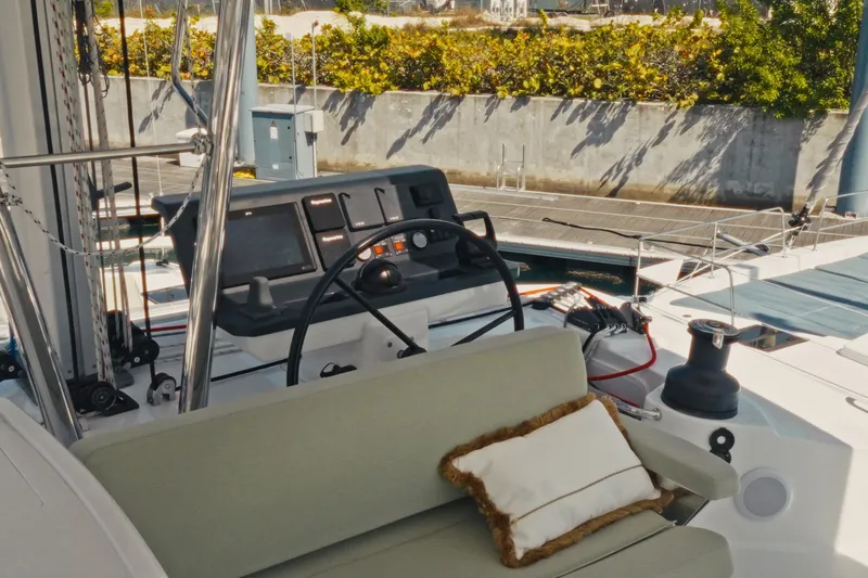 Slide: The Image of 2026 Bali 5.2 yacht cockpit with steering wheel and cushioned seating. - 5