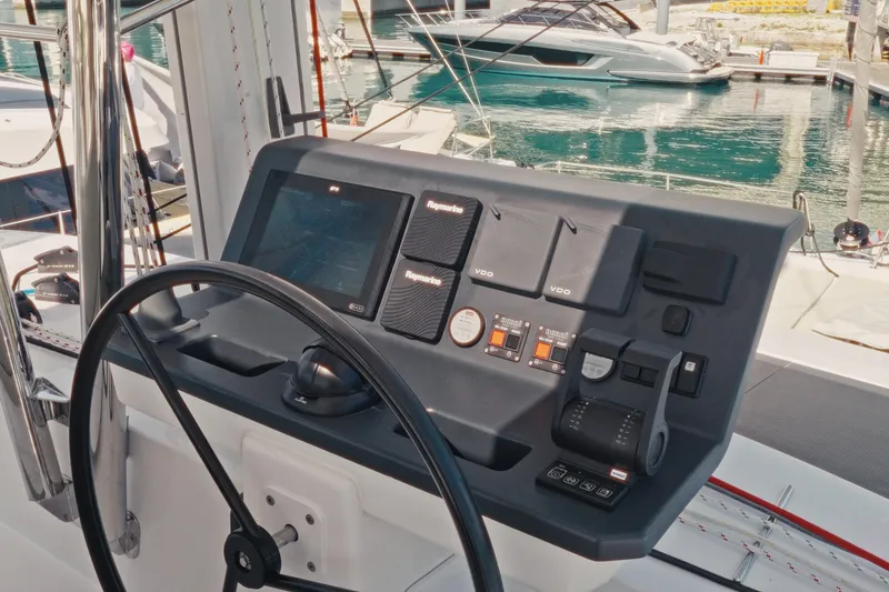 Slide: The Image of Helm station of 2026 Bali 5.2 yacht with navigation controls and steering wheel. - 6