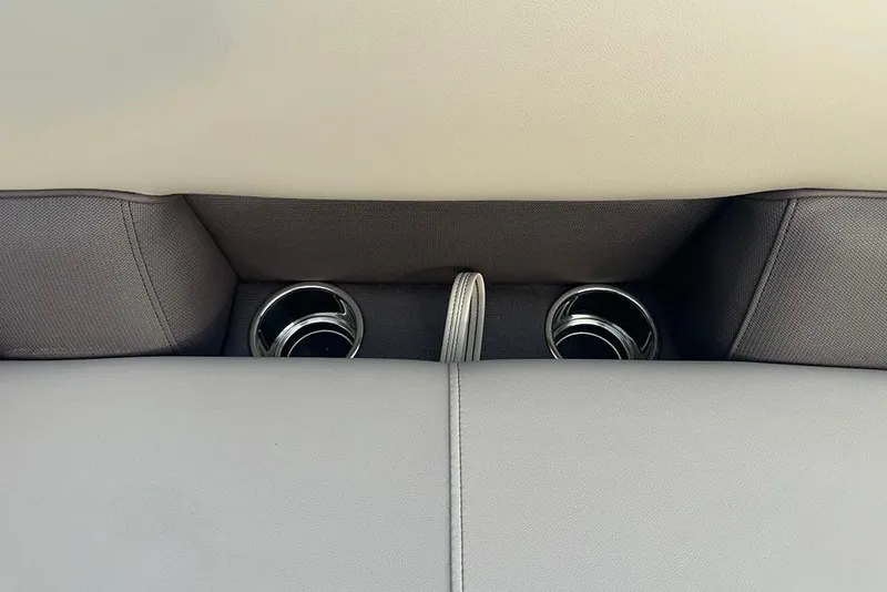 Slide: The Image of 2026 Bentley Pontoons Legacy 223 Swingback interior cup holders and seating detail. - 14