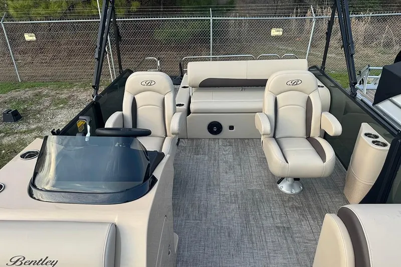 Slide: The Image of 2026 Bentley Pontoons Legacy 223 Swingback interior with beige seating and modern design. - 19