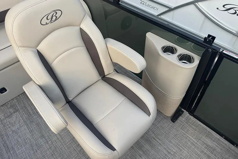 Slide: The Image of 2026 Bentley Pontoons Legacy 223 Swingback interior with luxury seating and cup holders. - 21