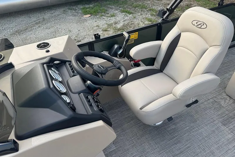 Slide: The Image of 2026 Bentley Pontoons Legacy 223 Swingback helm with steering wheel and captain's chair. - 22