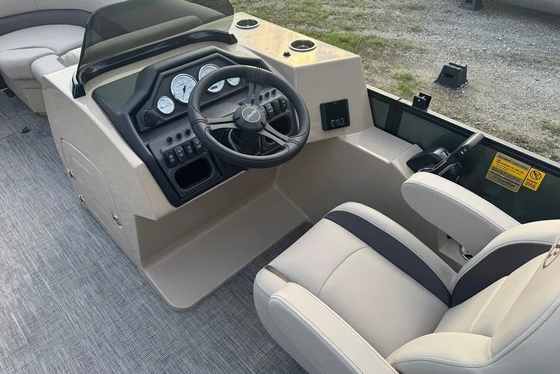 Slide: The Image of 2026 Bentley Pontoons Legacy 223 Swingback helm with steering wheel and control panel. - 23