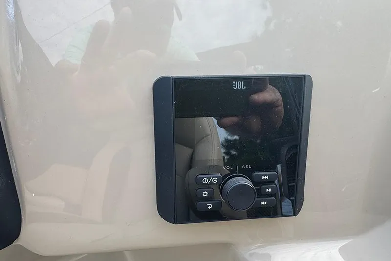 Slide: The Image of JBL audio control panel on 2026 Bentley Pontoons Legacy 223 Swingback. - 25
