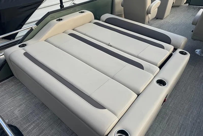 Slide: The Image of 2026 Bentley Pontoons Legacy 223 Swingback interior with luxurious seating and cup holders. - 28