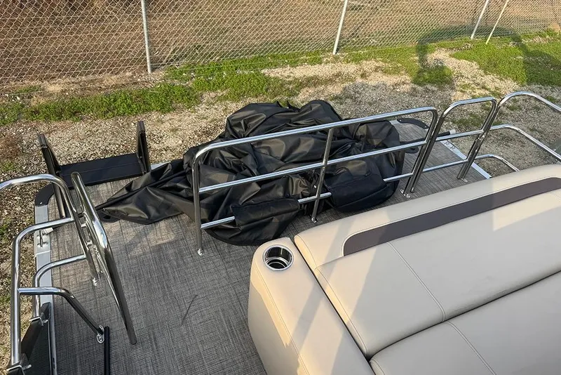 Slide: The Image of 2026 Bentley Pontoons Legacy 223 Swingback deck with seating and railing. - 31