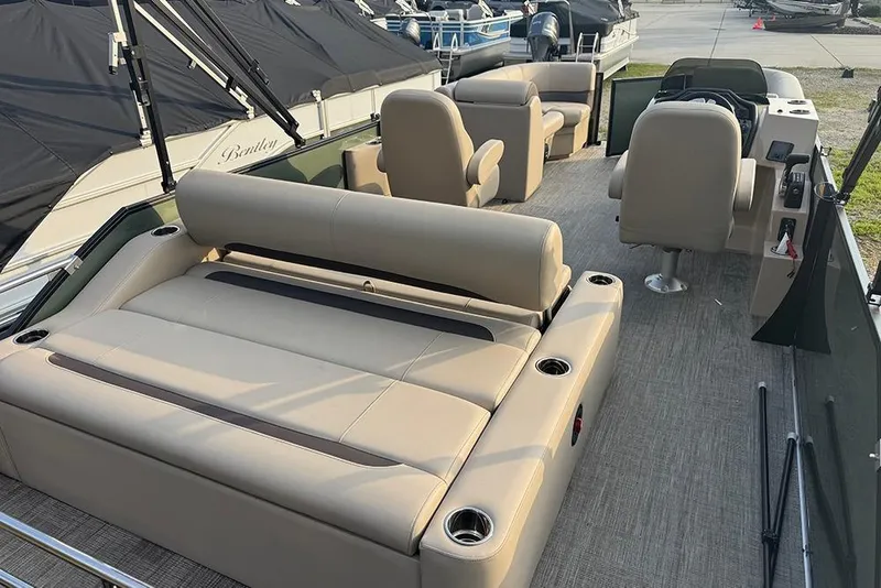 Slide: The Image of 2026 Bentley Pontoons Legacy 223 Swingback interior with beige seating and modern design. - 32