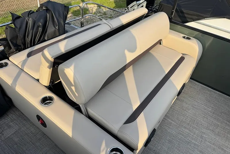 Slide: The Image of 2026 Bentley Pontoons Legacy 223 Swingback with beige seating and cup holders. - 36