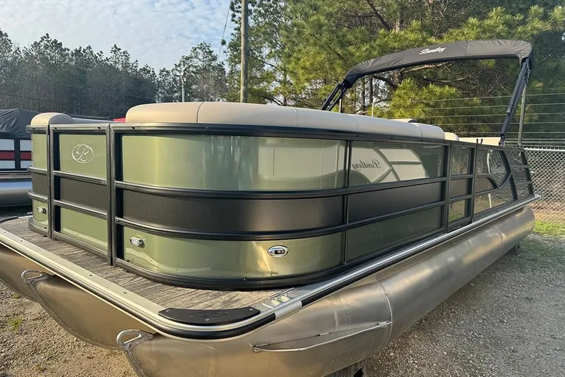 Slide: The Image of 2026 Bentley Pontoons Legacy 223 Swingback, green and black, parked outdoors. - 8