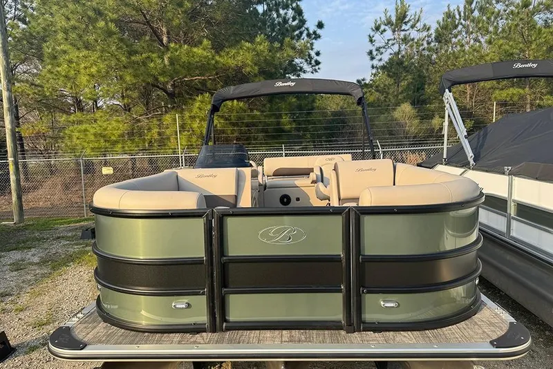 Slide: The Image of 2026 Bentley Pontoons Legacy 223 Swingback, green and beige, parked outdoors. - 9