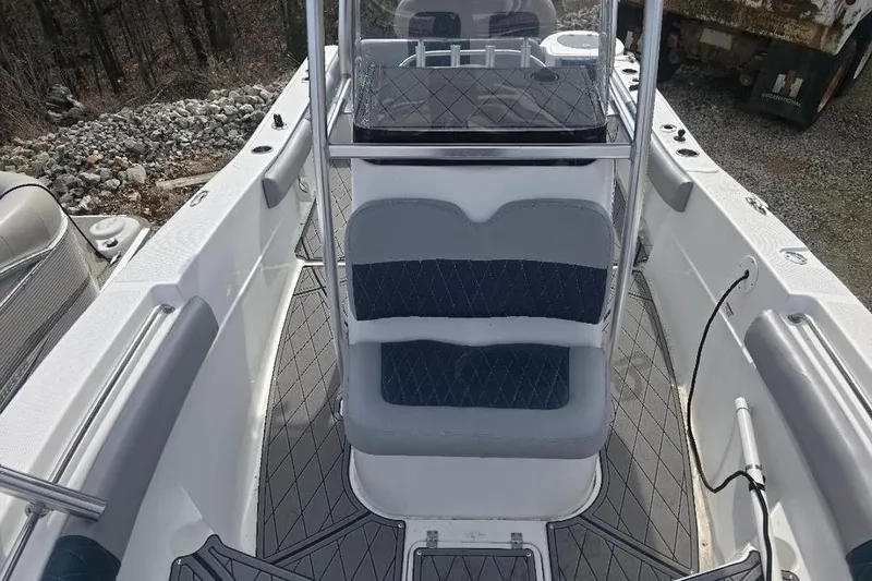 Slide: The Image of 2012 Sea Fox 226 Center Console boat interior with seating and console view. - 12