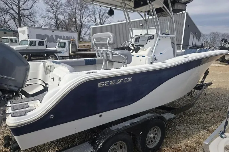Slide: The Image of 2012 Sea Fox 226 Center Console boat on trailer, featuring sleek design and modern equipment. - 2