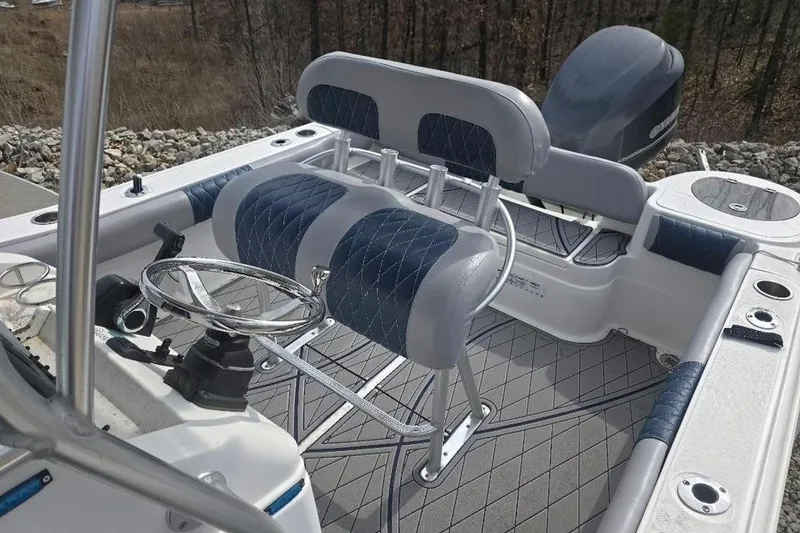 Slide: The Image of 2012 Sea Fox 226 Center Console boat interior with dual seats and steering wheel. - 4