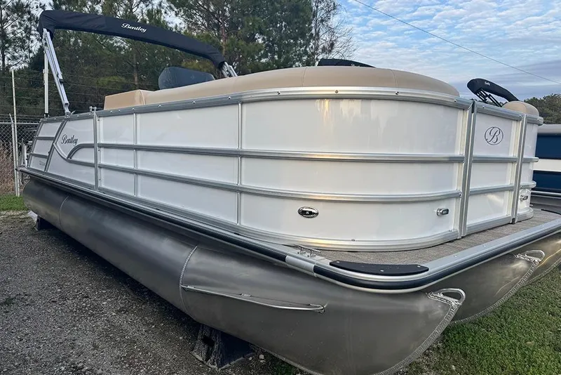 The Image of 2026 Bentley Pontoons Legacy 223 Swingback, sleek design, parked outdoors. - 0