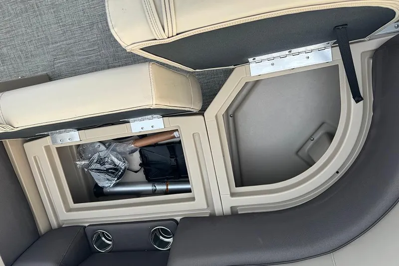 Slide: The Image of 2026 Bentley Pontoons Legacy 223 Swingback storage compartment with cup holders and accessories. - 11