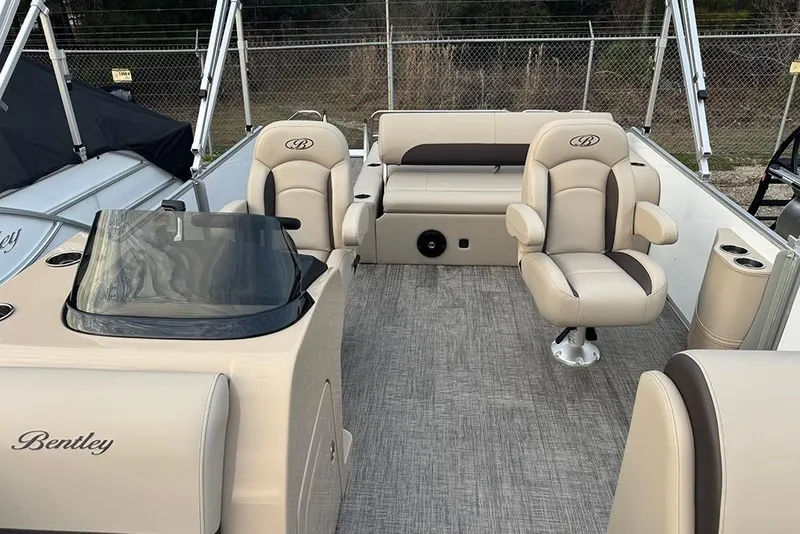 Slide: The Image of 2026 Bentley Pontoons Legacy 223 Swingback interior with beige seating and modern design. - 15