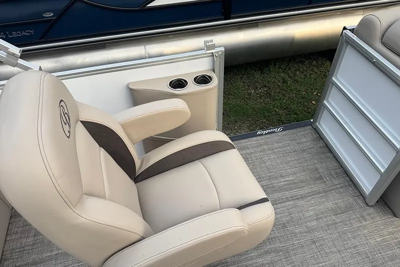 Slide: The Image of 2026 Bentley Pontoons Legacy 223 Swingback with luxurious seating and cup holders. - 20