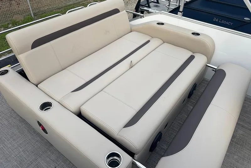 Slide: The Image of 2026 Bentley Pontoons Legacy 223 Swingback seating with cup holders and sleek design. - 23