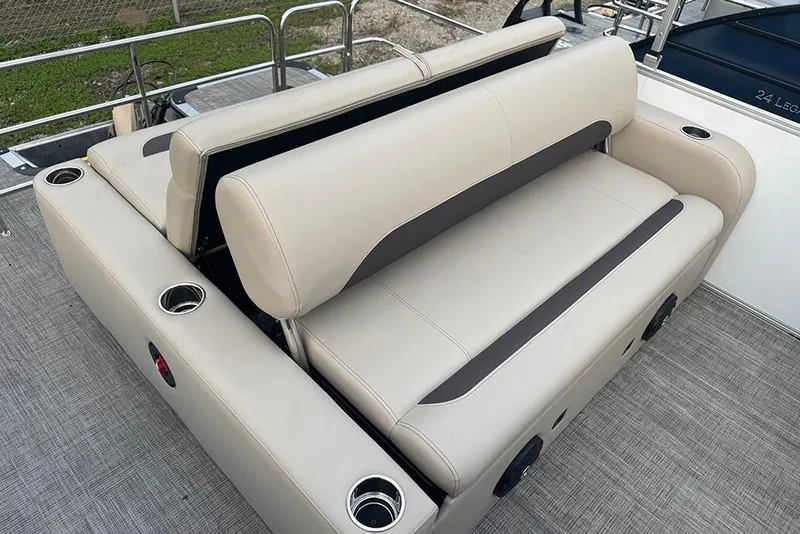 Slide: The Image of 2026 Bentley Pontoons Legacy 223 Swingback with beige seating and cup holders. - 24