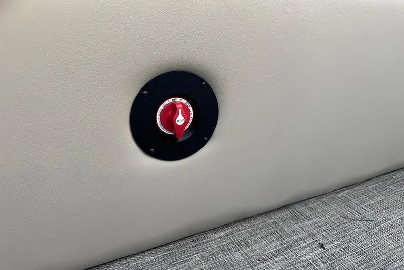 Slide: The Image of Battery switch on 2026 Bentley Pontoons Legacy 223 Swingback, beige panel background. - 27