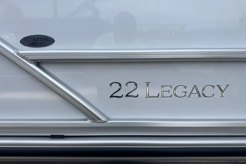 Slide: The Image of 2026 Bentley Pontoons Legacy 223 Swingback, Coastal Series emblem, sleek silver design. - 6
