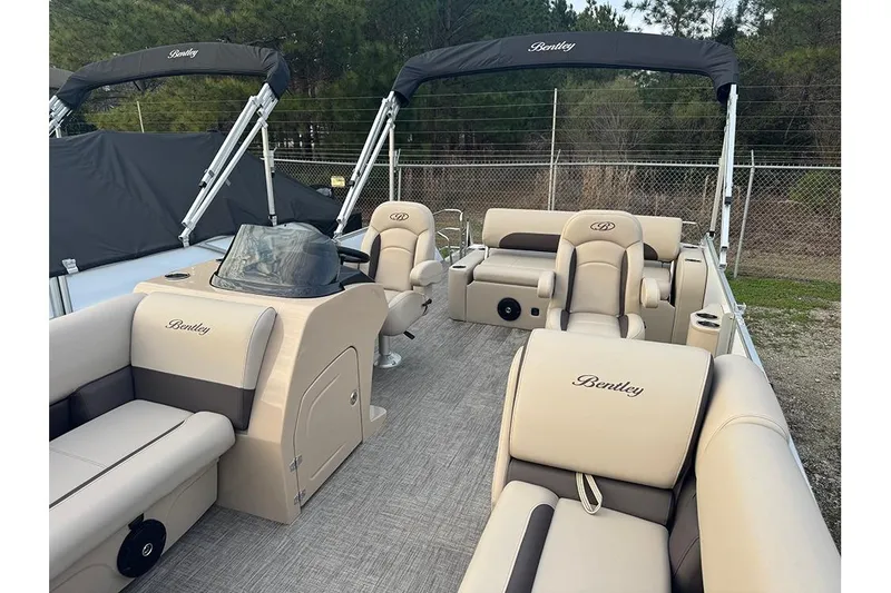 Slide: The Image of 2026 Bentley Pontoons Legacy 223 Swingback with luxurious beige seating and sleek design. - 9