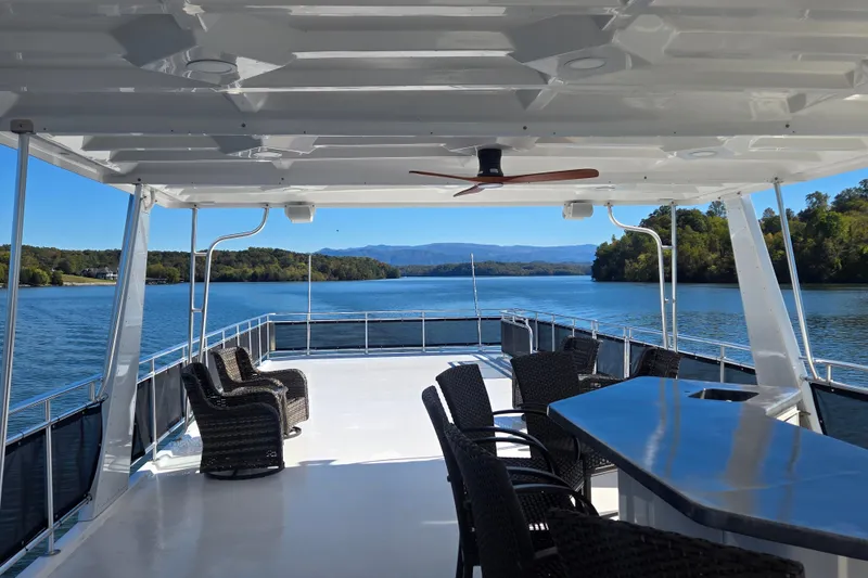 Slide: The Image of Luxurious 2013 Thoroughbred 80'x 18' houseboat with spacious deck and scenic lake view. - 11