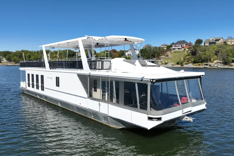Slide: The Image of Luxury 2013 Thoroughbred houseboat, 80'x 18', cruising on a serene lake. - 2